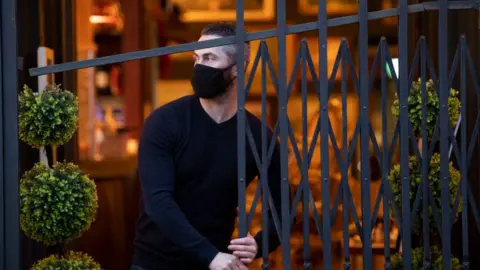 Getty Images Man shuts up bar