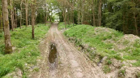 Piled waste along the track