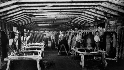Workers nailing on skins at Baily’s – skins were stretched on a frame, pegged and then dried