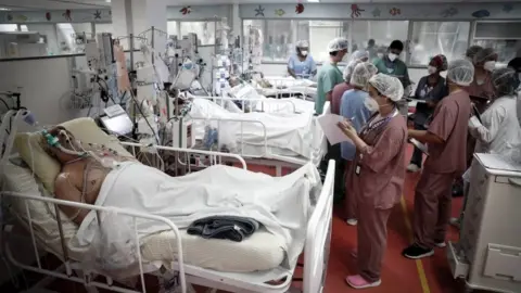 EPA Medical personnel work at the intensive care unit in a hospital near São Paulo, Brazil. Photo: March 2021