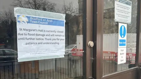 A sign outside St Margaret's Hall saying it is closed due to flood damage