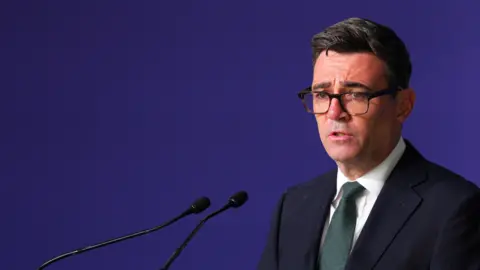 Reuters Prime Minister Andy Burnham delivers closing remarks during the first National Day for Victims and Survivors of Terrorism memorial event on 21 August, 2026.