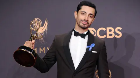 Getty Images Ahmed with his Emmy Award for The Night Of in 2017