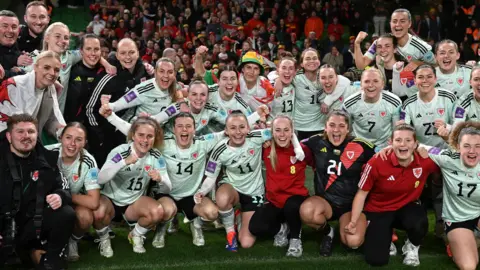 Getty Images Players of Wales airs  for squad  a photograph  pursuing  triumph  successful  the UEFA Women's EURO 2025. 