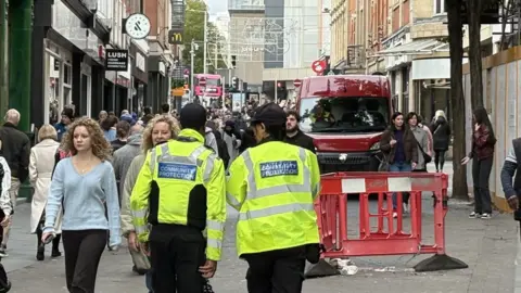 BBC Officers walk down road