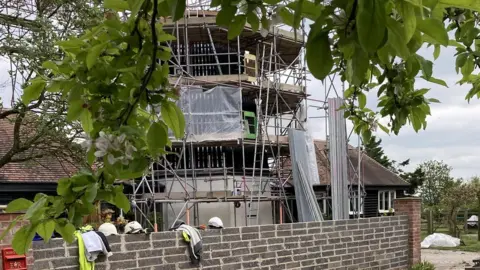 BBC Smock Tower Mill with scaffolding surrounding it