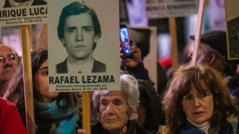 Thousands of relatives and relatives carry photos with the images of the disappeared persons in the last military dictatorship in the March of Silence in Montevideo on May 20, 2023.