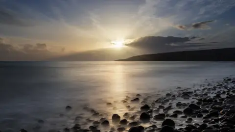 Sunset on a rocky shore at Gairloch