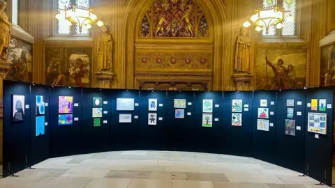 Surrey and Borders Partnerships NHS Trust An ornate room with an art display in it.