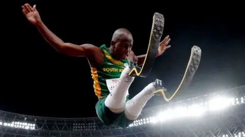 Ntando Mahlangu doing the long jump at the Tokyo Paralympics, 28 August 2021