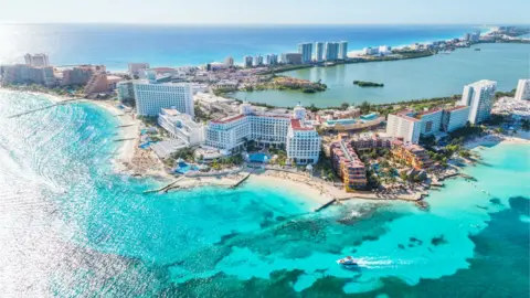 Getty Images The group was stranded in Cancun, Mexico, after airlines refused to fly them back to Canada