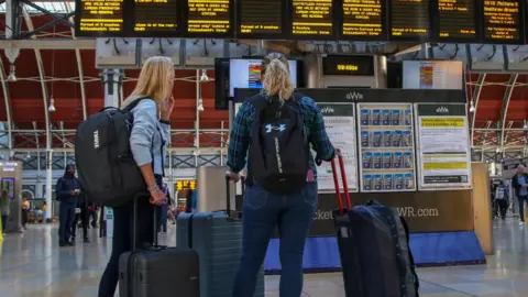 Getty Images Train passengers