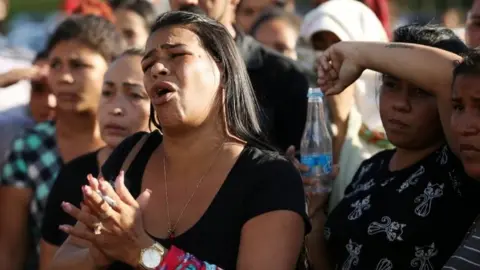 Reuters Relatives of inmates react in front of a prison complex in the Brazilian state of Amazonas after prisoners were found strangled to death in four separate jails, according to the penitentiary department in Manaus, Brazil May 27, 2019