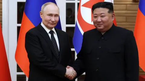 SPUTNIK/EPA-EFE/REX/Shutterstock Russian President Vladimir Putin shakes hands with North Korean leader Kim Jong Un during their meeting in Pyongyang, North Korea, 19 June 2024.