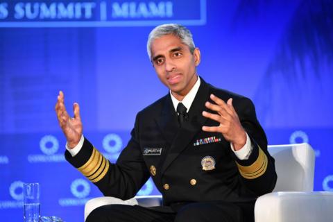 US Surgeon General Vivek Murthy expresses with his hands at a summit