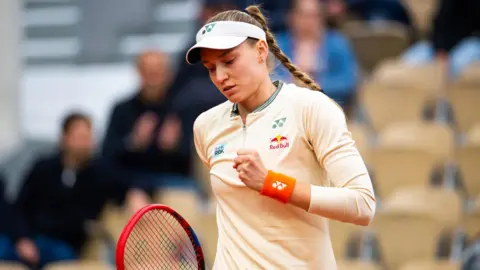 Elena Rybakina celebrates winning a point against Greet Minnen