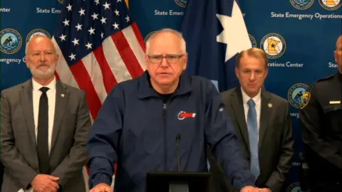 Minnesota Governor, Tim Walz, speaks to reporters