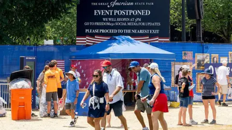 "Event Postponed" signage during the Great American State Fair on the National Mall in Washington, DC on Friday