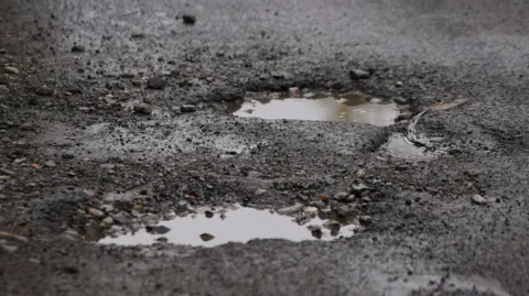 BBC Pothole in road