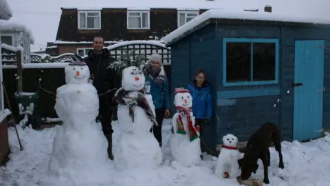 Amy Jones The Jones family with their snowmen