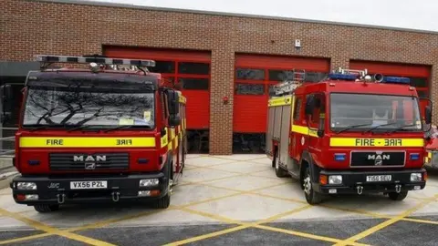 BBC Two fire engines outside a fire station