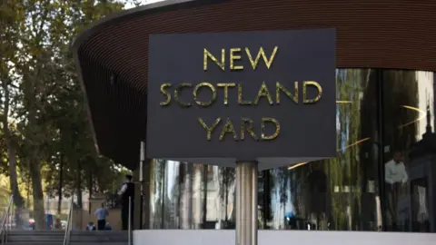 Reuters/Hollie Adams Exterior of New Scotland Yard, with revolving sign in the foreground