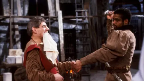 BBC Trevor Peacock (l) as Titus and Hugh Quarshie as Aaron in a BBC production of Titus Andronicus