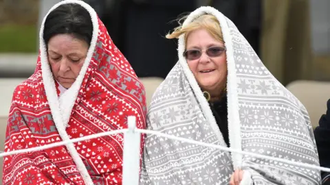 PA Two women wrapped in blankets