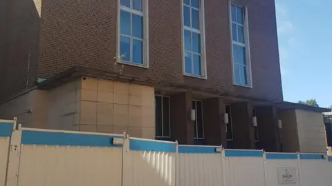 The Wulfrun Hall in Wolverhampton with construction boards in front