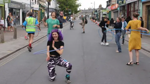 Dave Baigent Hula hoopers on Mill Road, Cambridge