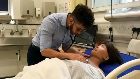 King's College London Yousef with medical training dummy