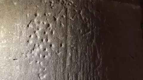 Antonia Thomas Peck marks in pillar