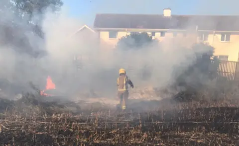 TWFRS Firefighter tackling blaze in Walbottle