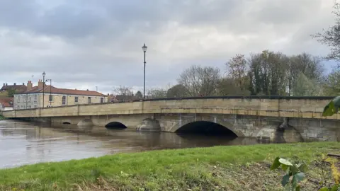 Rob Dowell/BBC Tadcaster Bridge with river levels high underneath