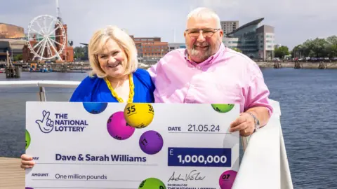 National Lottery Dave and Sarah Williams with cheque
