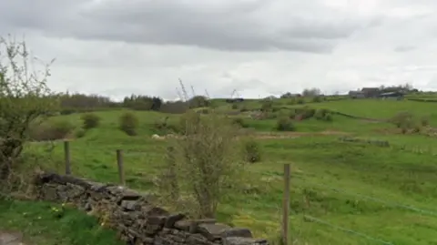 Google A Google streetview shot of the land in Littleborough, showing green open land and dry-stone walling