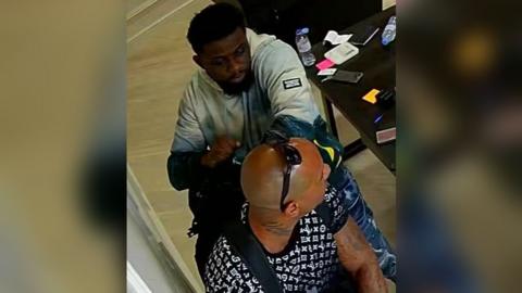 CCTV image of two men during watch shop robbery