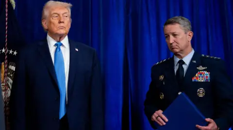 EPA File photo showing US President Donald Trump (L) and Chairman of the Joint Chiefs of Staff Gen John Caine (R) attending a news conference at the Mar-a-Lago Club in Palm Beach, Florida (3 January 2026)