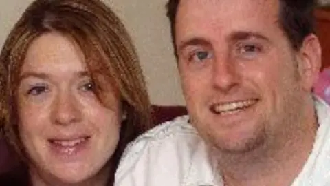 Swindon Advertiser A grainy image of Joanne Young and Philip Young. Jo has long brown hair and Philip has short dark hair. They are both looking at the camera and smiling. 