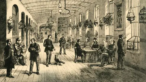The Print Collector/Getty Images A Ward in Bethlehem Hospital', (circa 1878). Interior of the Bethlem Royal Hospital, a psychiatric hospital in London dating back to the 13th century. This Victorian view shows a clean and well-lit ward, with patients playing chess, reading newspapers and playing with a dog. A very different regime from earlier times when distressed patients were kept chained up and put on show for the entertainment of visitors, the origin of the term 'bedlam' (a corruption of Bethlehem). From Old and New London: A Narrative of Its History, Its People, And Its Places. The Southern Suburbs, Volume VI, by Edward Walford. [Cassell, Petter, Galpin & Co., London, Paris & New York, circa 1878]. Artist Unknown. (Photo by The Print Collector/Getty Images)