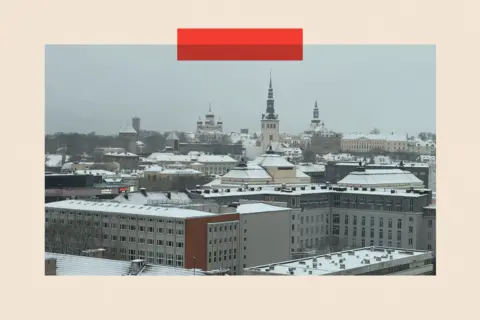 Buildings in Tallinn which are slightly snow covered 
