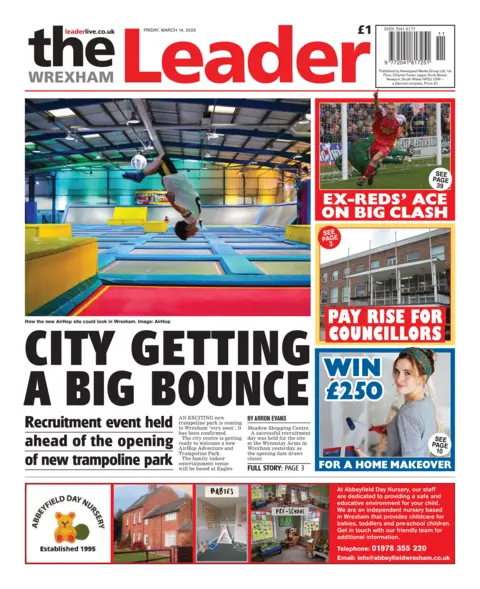 Wrexham Leader The front page of the Wrexham Leader has a photo of a gymnasium with a boy upside down in the air above a series of colourful trampolines. The headline says 'city getting a big bounce'. On the right hand side, other headlines read: 'Ex-reds' ace on big clash' with a photo of a footballer with his hand in the air, and 'pay rise for councillors'