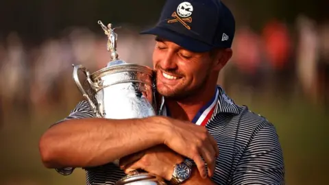 Bryson DeChambeau celebrates winning the US Open