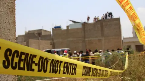 Pakistani security officials inspect the site of an alleged Indian drone strike in Karachi, Pakistan, 08 May 2025. 