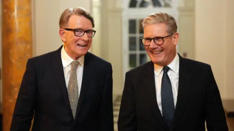 Reuters Sir Keir Starmer smiles alongside Lord Mandelson at the UK ambassador's residence in Washington DC.