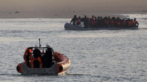 File photo of a French rescue vessel with a group of migrants on an inflatable dingy