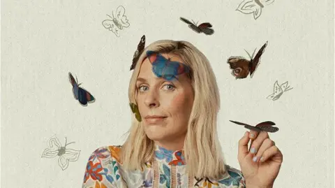 Supplied Sara Pascoe wearing a multi-colour shirt with butterflies around her.