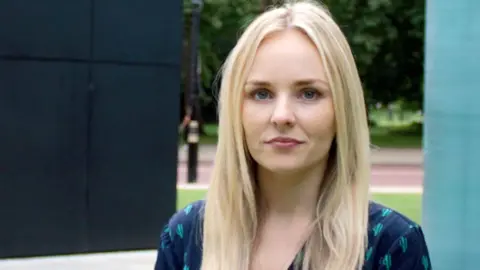 PA Media Lissie Harper, a woman with long, blonde hair, looks at the camera