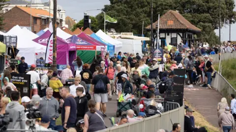 Tendring District Council A crowd of people mulling around some of the marquees at a previous airshow