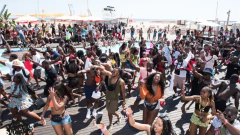 Afronation/Adesegun Adeosun Jr People dancing at afronation festival